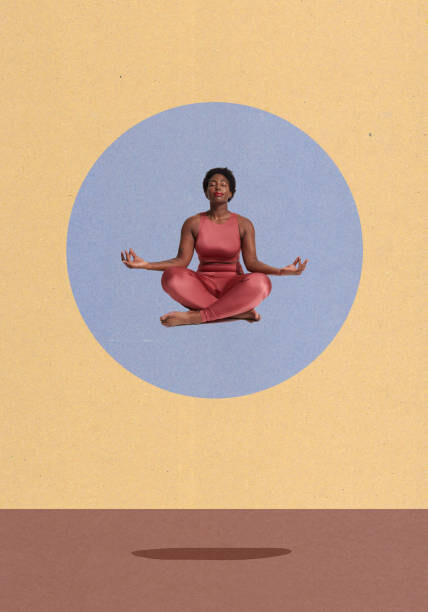 Fototapeta woman meditating sitting crosslegged