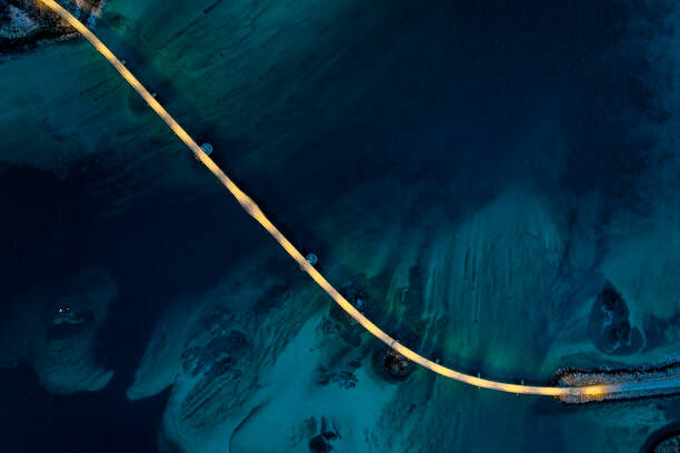 Samolepka Illuminated bridge in the cold arctic sea at dusk