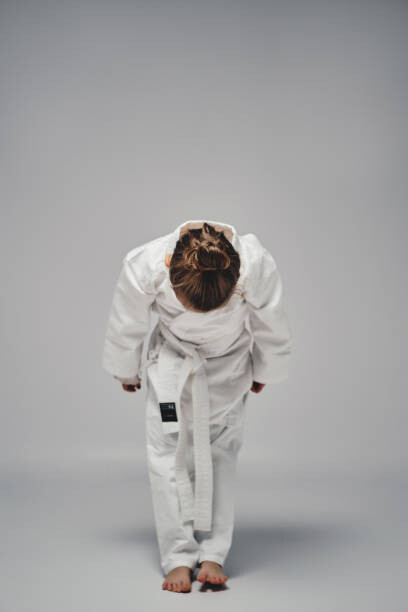 Samolepka Karate girl bowing and saluting