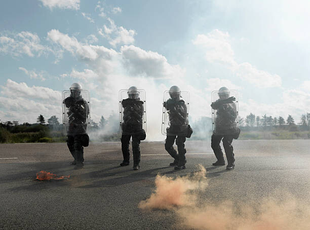 Billede på lærred Policemen with shields
