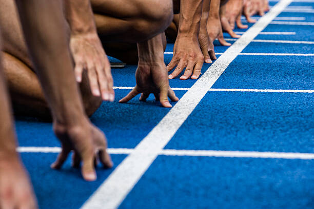 Bilde på lerret Track sprinters lined up at starting