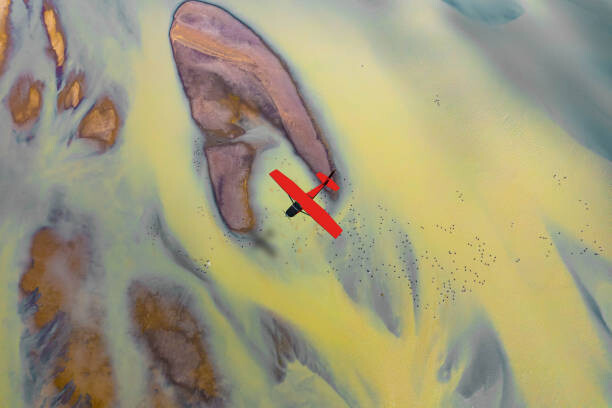 Obraz na plátně Aerial view of red plane flying