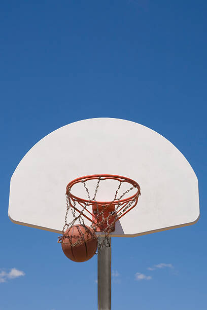 Obraz na plátně Basketball falling through hoop