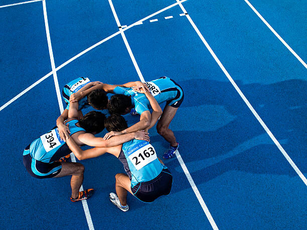Plakat Athletes making a circle