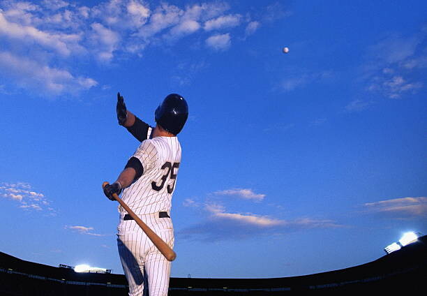 Plakat Baseball player hitting ball out of