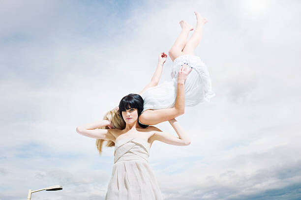 Plakat beautiful woman carrying woman on shoulders