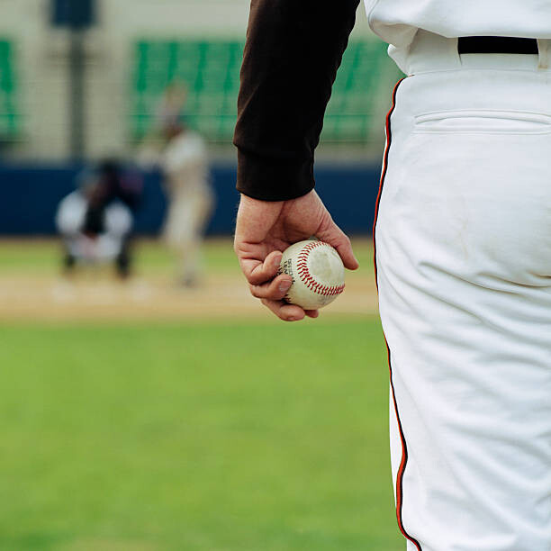 Plakat Pitcher on Mound Holding Baseball