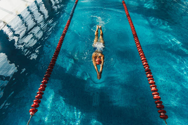 Plakat View from above of woman swimming