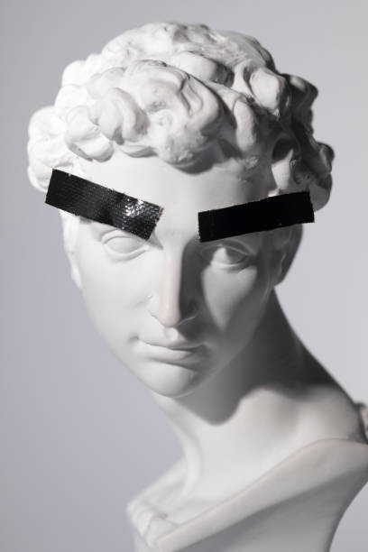 Plakát Head sculpture with tape over eyebrows