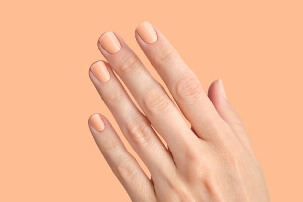 Plakát Manicure in the colors of the year Peach Fuzz.