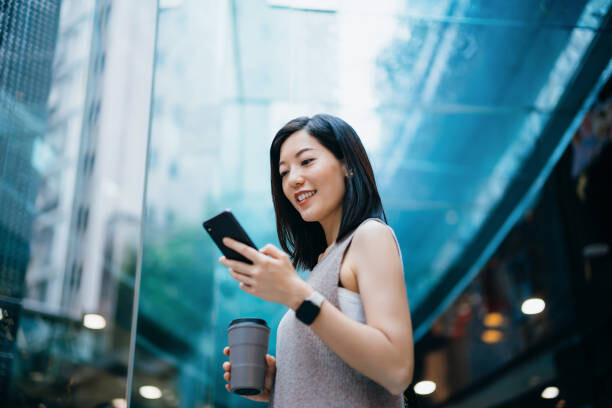 Plakát Successful young Asian businesswoman holding a