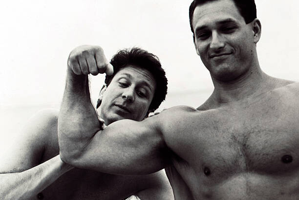 Plakát Admiring Muscular Man