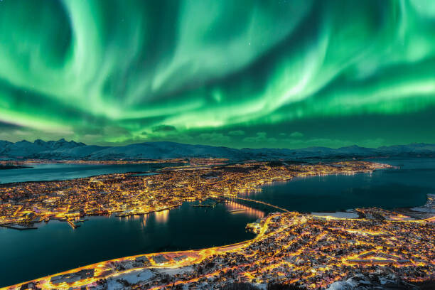 Plakát Aurora Borealis dancing over Tromso Urban