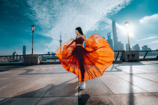 Plakát Beautiful young woman in red skirt