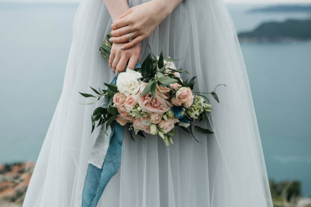 Plakát Bride holding a wedding bouquet