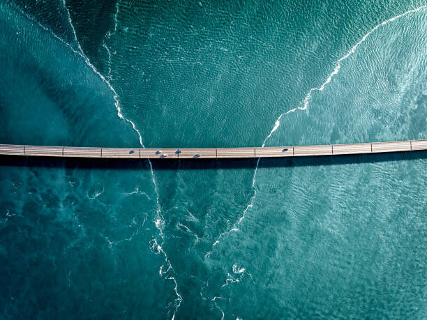 Plakát Driving on a bridge over deep blue water