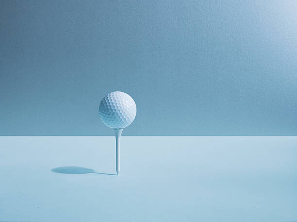 Plakát Golf ball balancing on tee