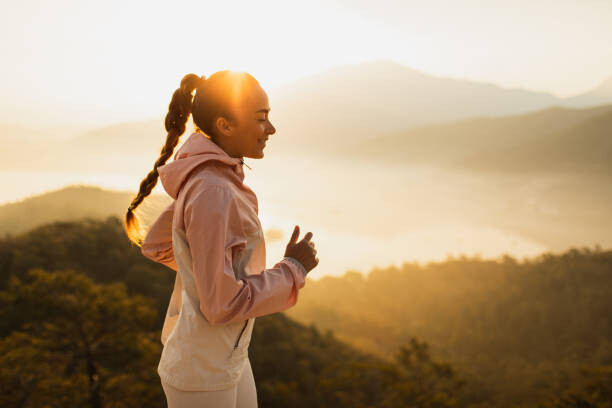 Plakát Happy young woman running outdoors with