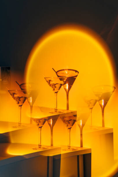 Plakát Kaleidoscope martini cocktail in orange neon