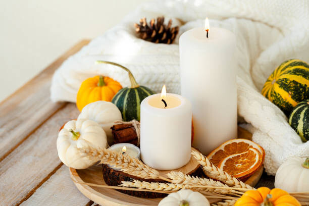 Plakát Pumpkins and candle on a wooden table