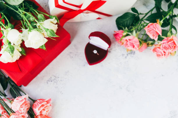 Plakát Ring with diamond among bouquets of