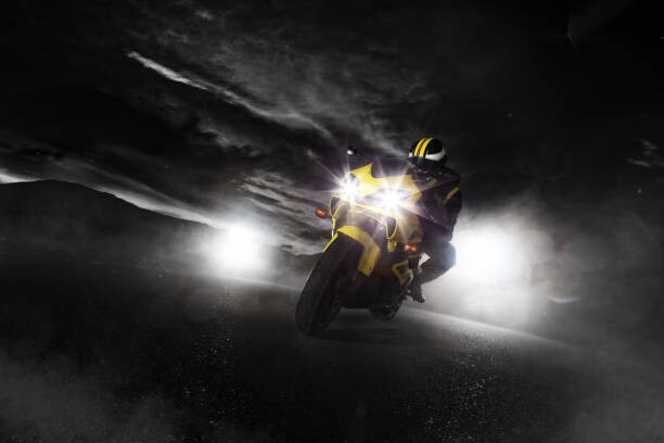 Plakát Supersport motorcycle driver at night with