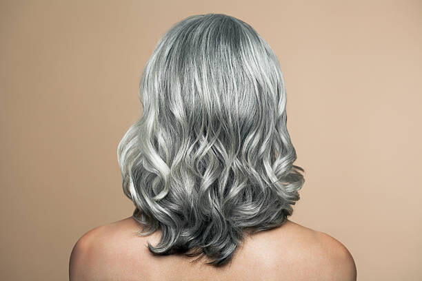Plakát Woman with grey hair, back view.
