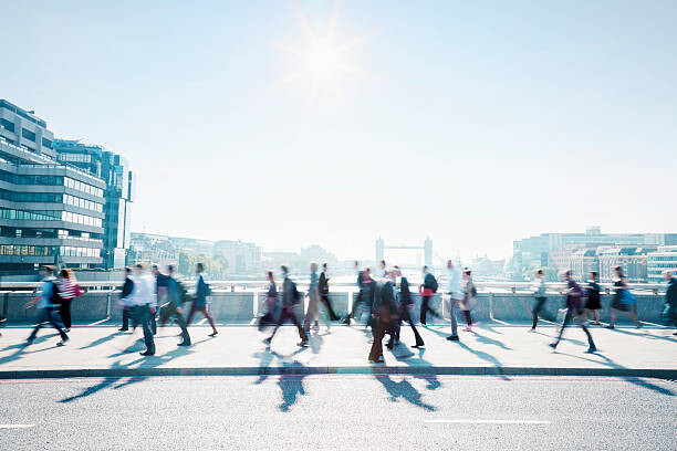 Plakát Workers walking to work through the city.