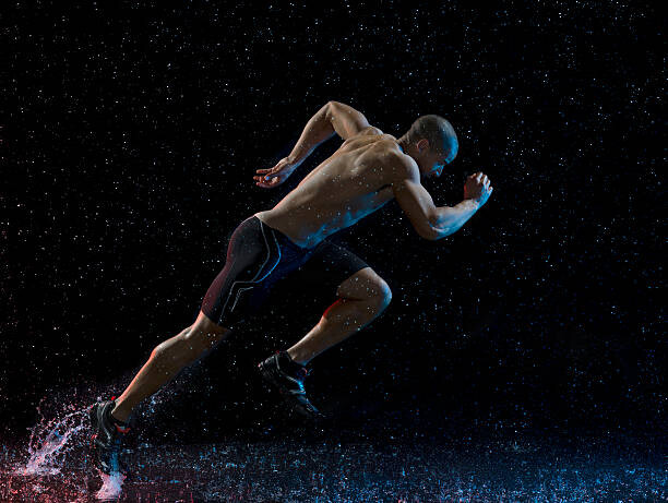 Obraz na płótnie Athlete runner running through rain
