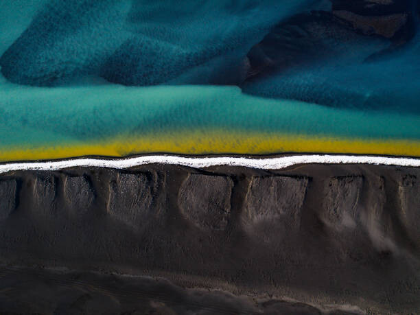 Obraz na płótnie Drone shot showing a black sand