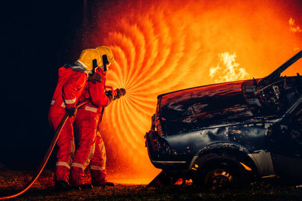 Obraz na płótnie Firefighters Battling Blaze with Water