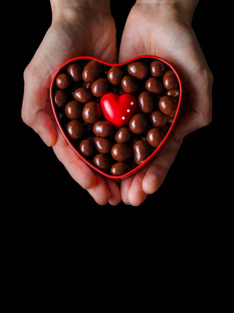 Obraz na płótnie Human hands holding red heart shaped
