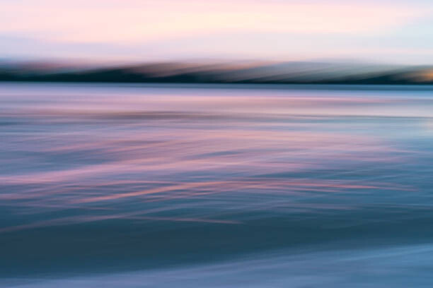 Obraz na płótnie Motion blur effect in coastal sunrise