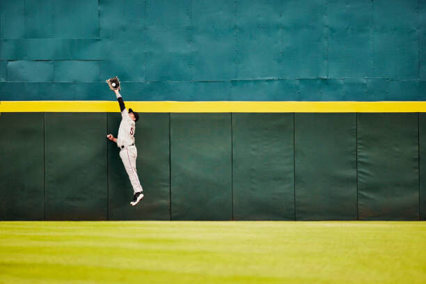 Obraz na płótnie Wide shot baseball player jumping for