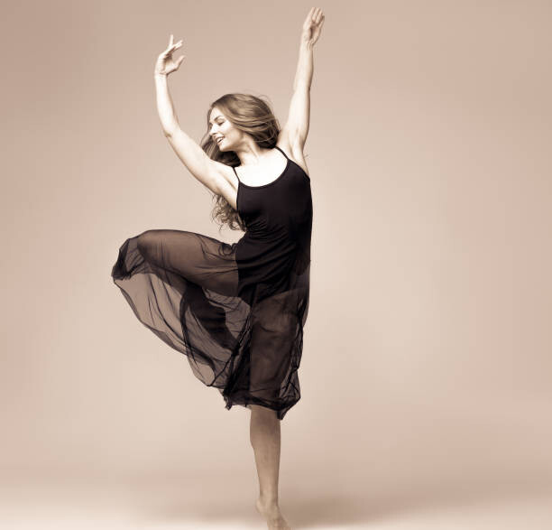 Poster Ballet dancer woman black dress. Studio shot.