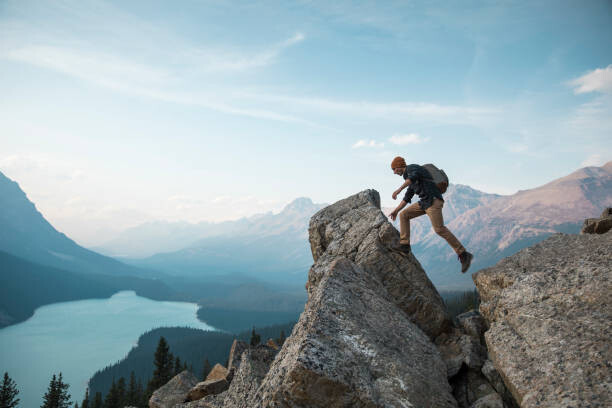 Poster A man standing on a rocky