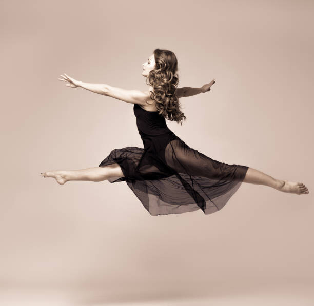 Poster Ballet dancer woman black dress. Studio shot.