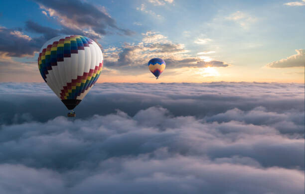 Poster Colorful hot air balloon flying above the clouds
