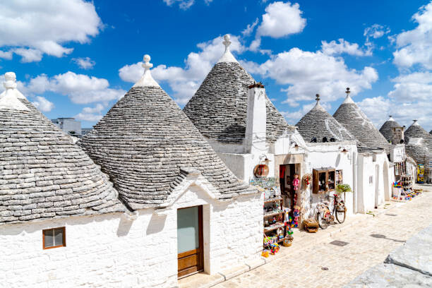 Poster White Trulli huts in summer, Alberobello, Puglia