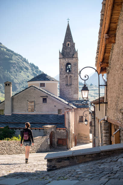 Poster Young Adult Woman Walking Through Quaint