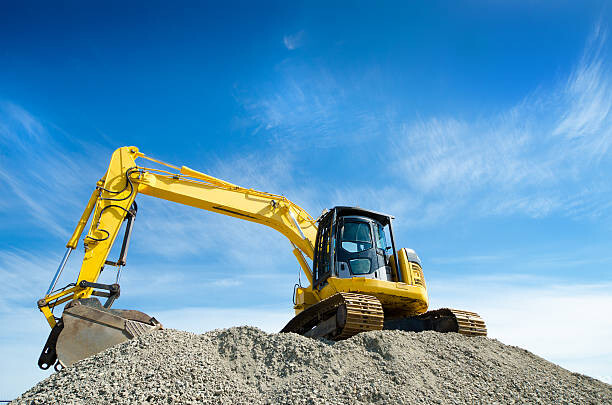 Poster Backhoe on a Gravel Pile