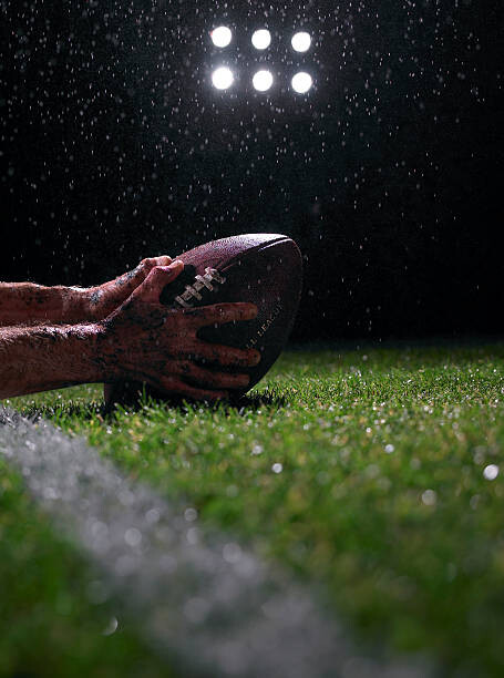 Tablou pe pânză Hands of american football player with