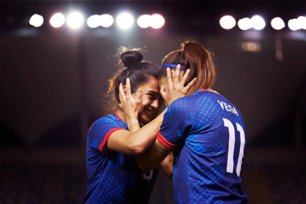 Tablou pe pânză Two young athletes touch their heads