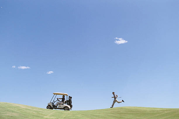 Tableau sur toile Golfer Chasing Golf Cart