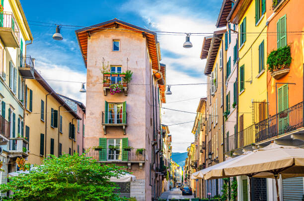 Tableau sur toile Traditional colorful building with balconies, shutter
