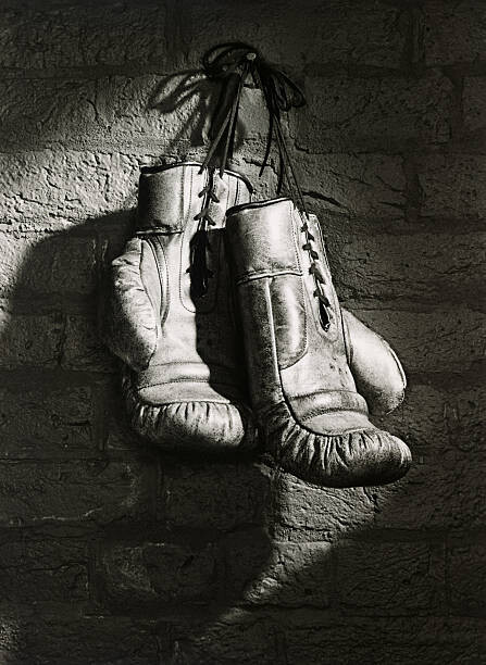 Vászonkép BOXING GLOVES HANGING FROM NAIL (B&W)