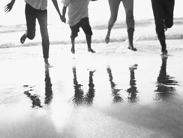 Vászonkép Family running on beach